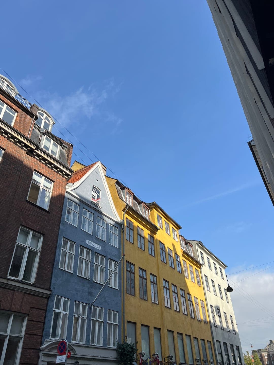 Brick, blue and yellow houses on a Copenhagen street